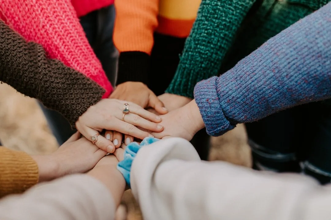Team hands stacked together